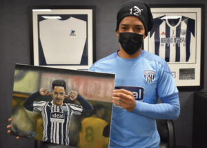 Matheus Pereira with the Original Oil Painting being auctioned for Charity
